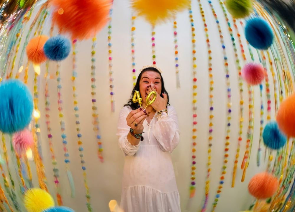 Guest celebrating a 40th birthday at the photo booth