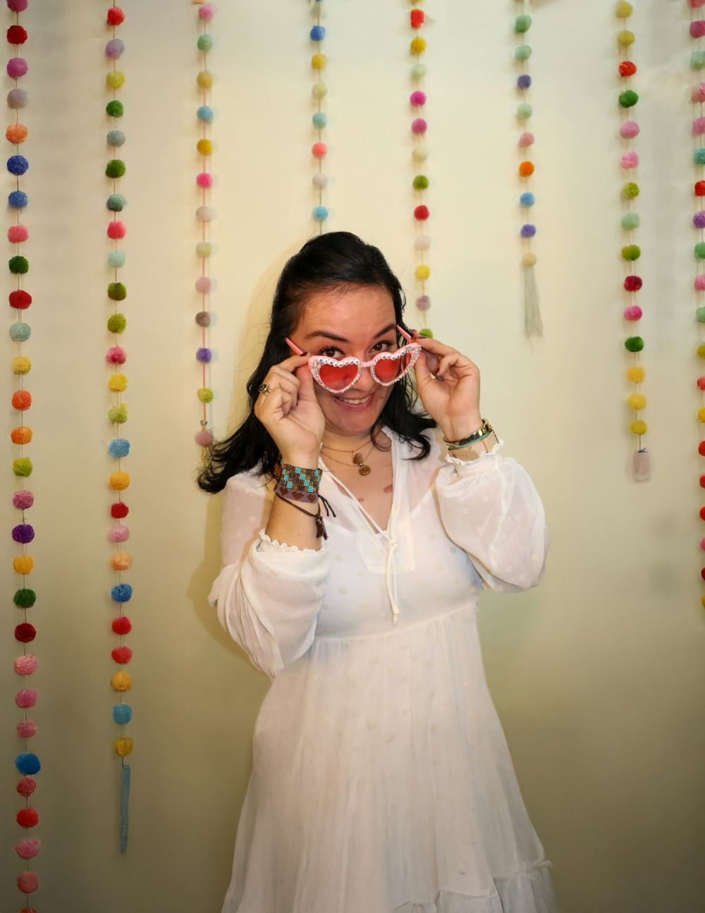 Guest in heart-shaped glasses at a photo booth